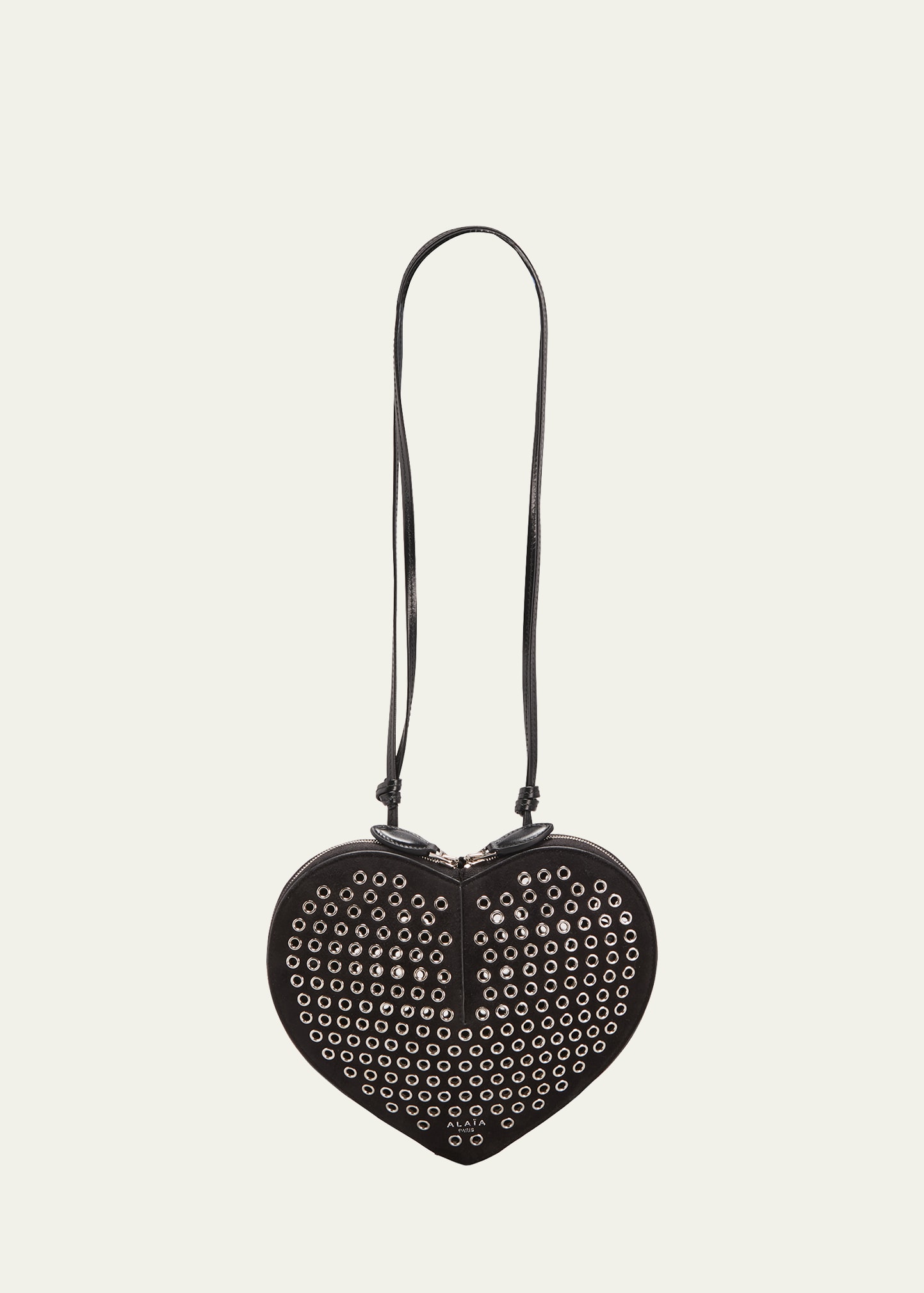 ALAÏA LE COEUR CROSSBODY BAG IN LUX LEATHER WITH GROMMETS