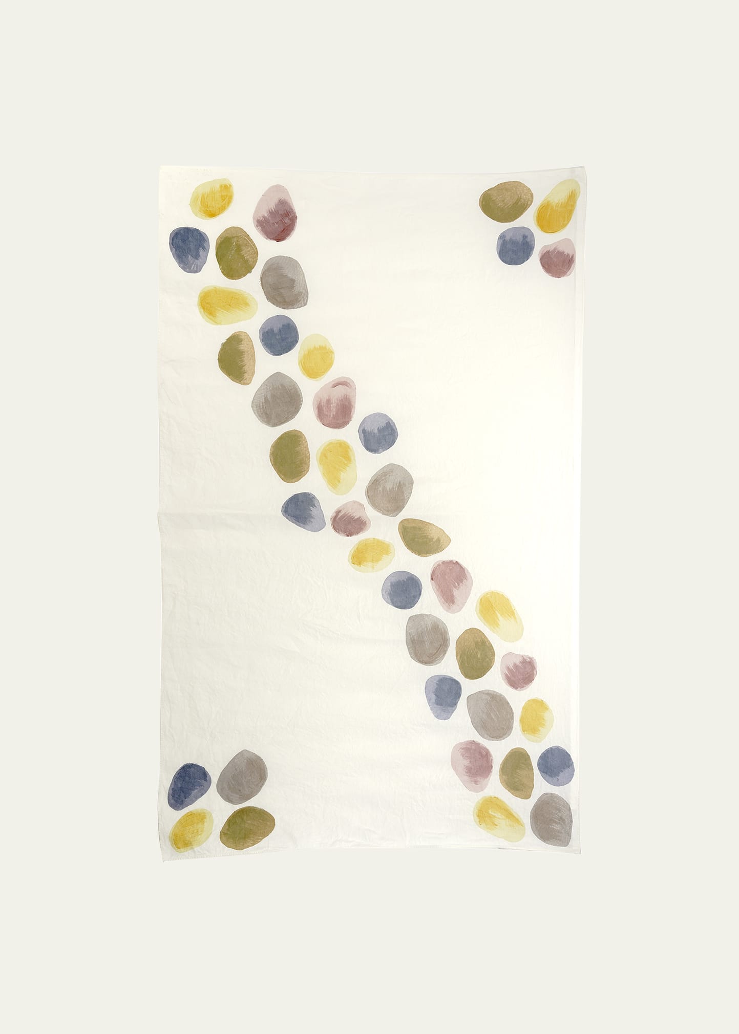 Sassi Stones on White Linen Tablecloth