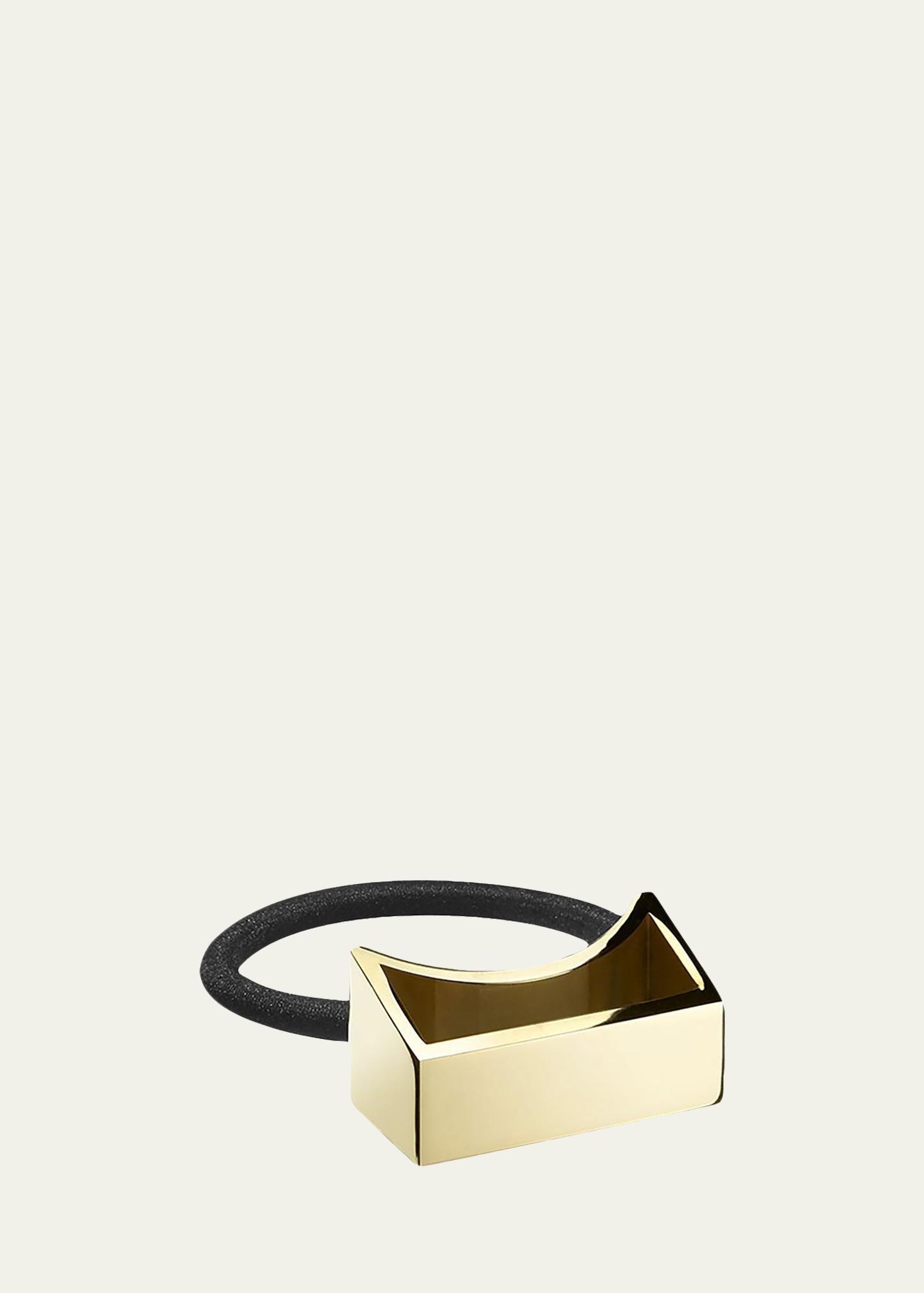 ORIBE gold plated metal pony tail holder with bag The Ponytail Cuff Trend Gives Cuffing Season a New Meaning  main image 3
