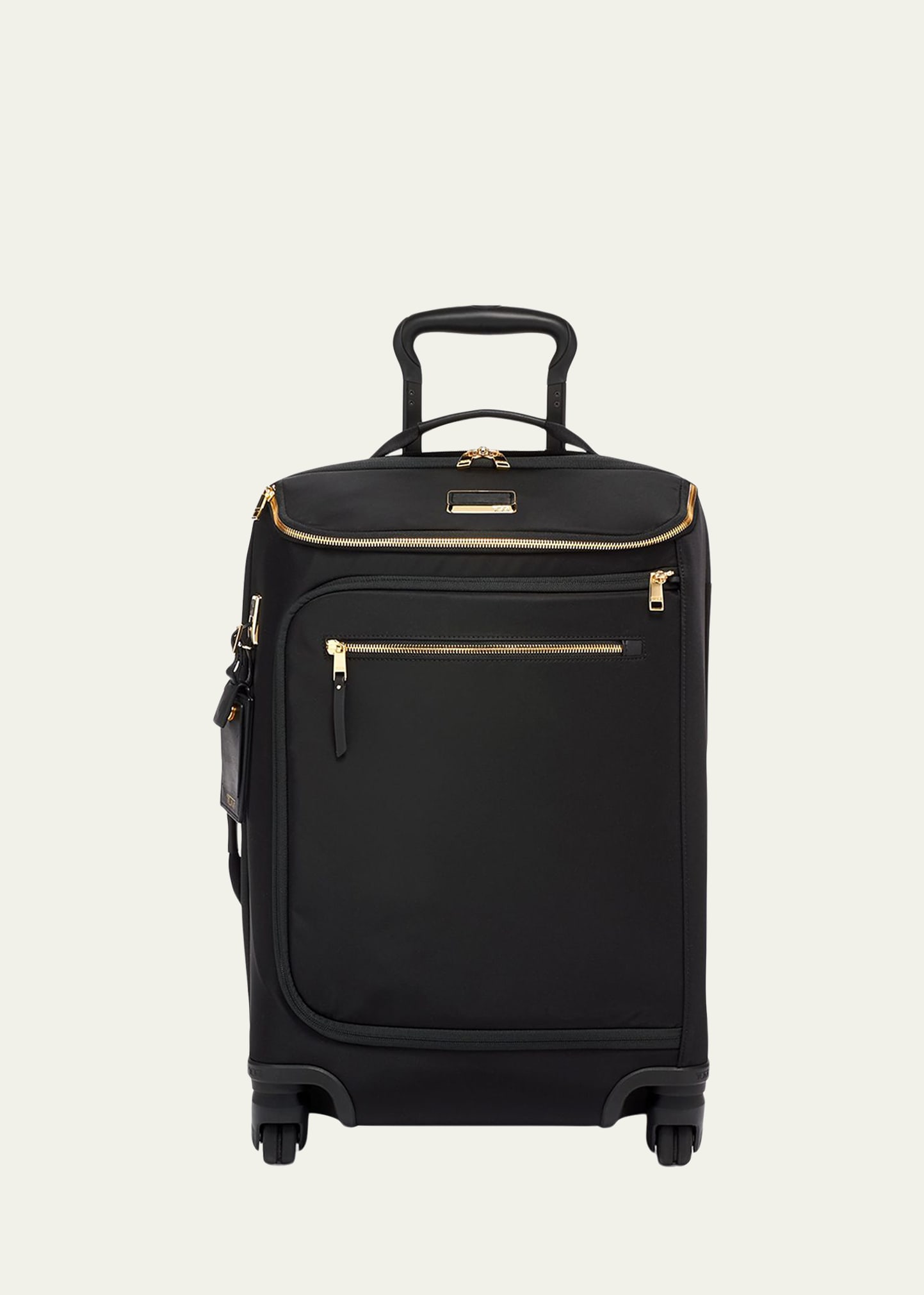 Tumi black 2025 and gold luggage