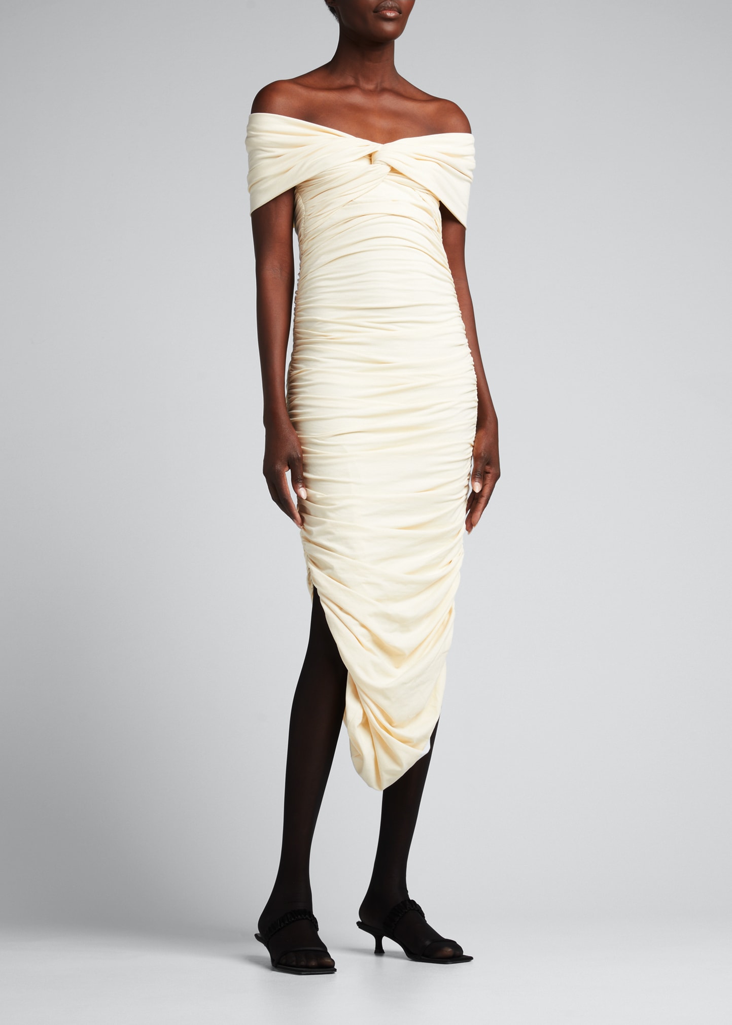 khaite marca off shoulder dress Effortless, but oh-so-glam  The Khaite The Marca Dress is made of draped  jersey to hug your body in all the right ways. A banded off-the-shoulder  neckline flows into a softly ruched