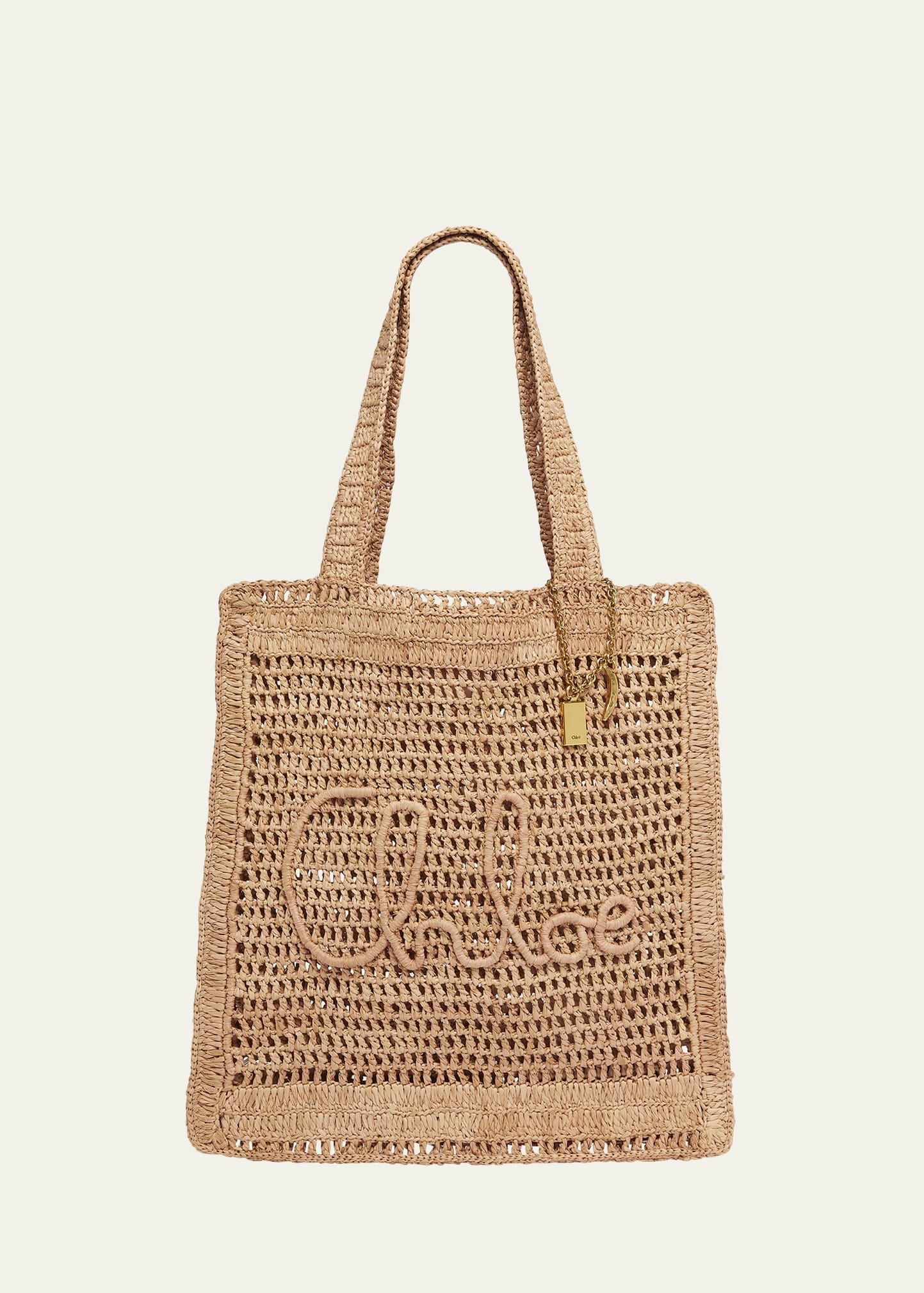 トートバッグ Chloe Black Raffia Estate Banana Shopping Bag Chloé Summer Banana Tote Bag In Raffia in Black | Chloé US