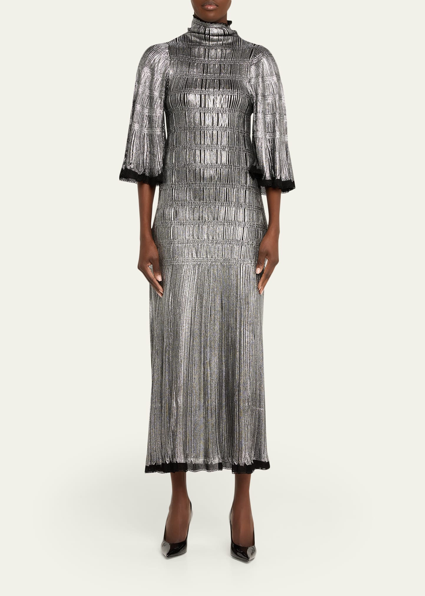 lanvin metallic dress Fi wears a metallic midi dress featuring flowing sleeves and a stand-up  collar, accented with Lanvin jewelry. #LANVINHOLIDAY #LANVIN