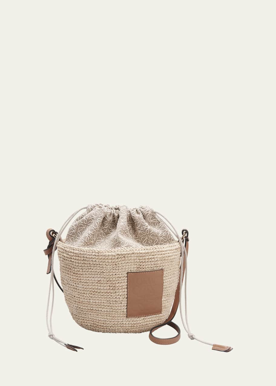 Image 1 of 1: x Paula’s Ibiza Pochette Bag in Raffia with Drawstring Pouch and Leather Strap