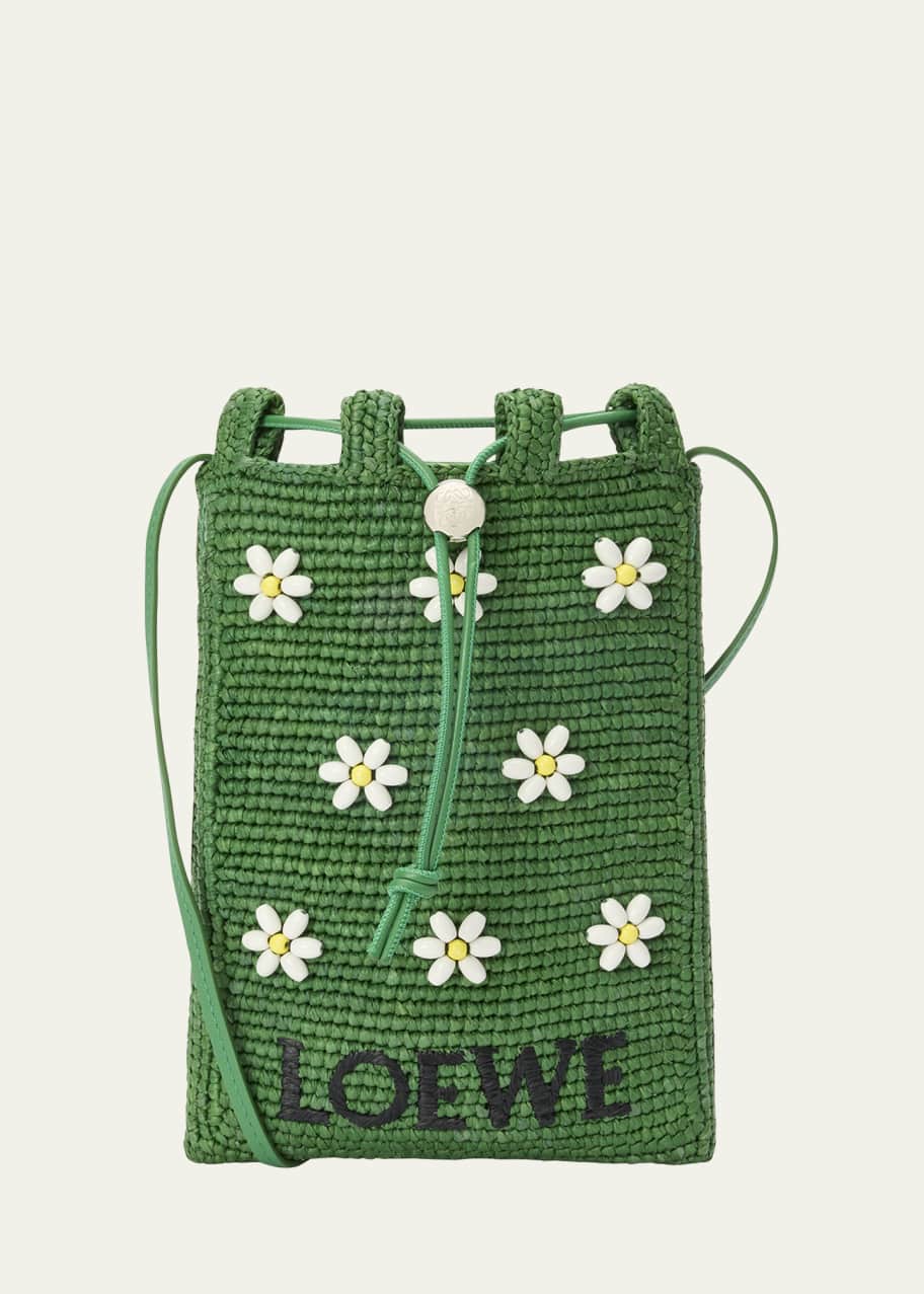 Image 1 of 1: x Paula’s Ibiza Drawstring Pocket Flower Crossbody Bag in Raffia