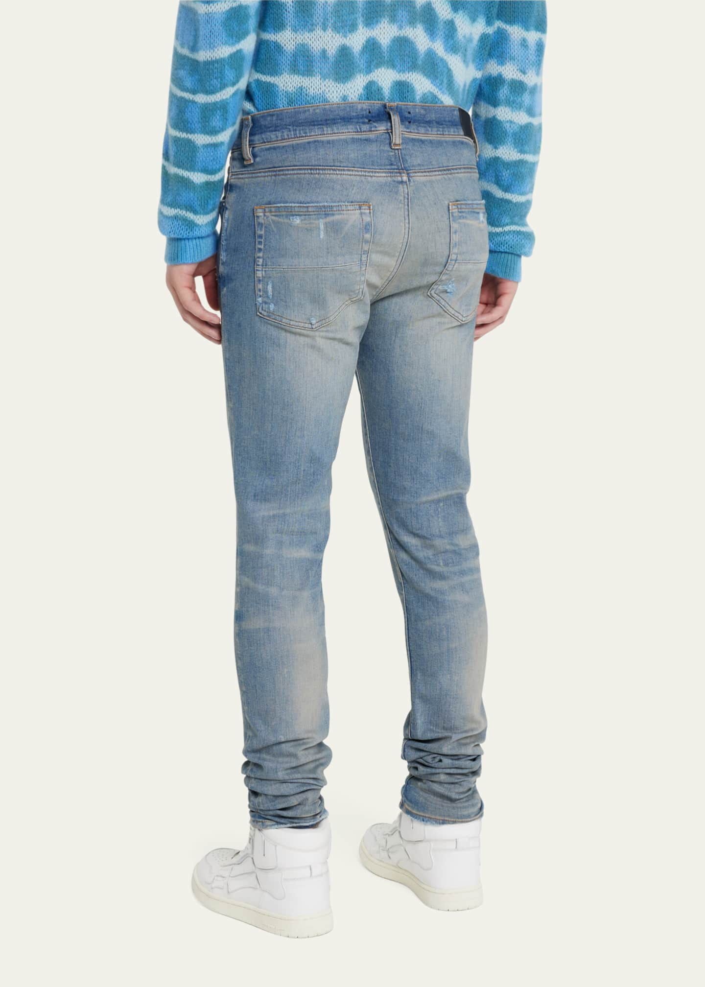 Amiri Men's Faded Skinny Jeans with Staggered Logo - Bergdorf Goodman