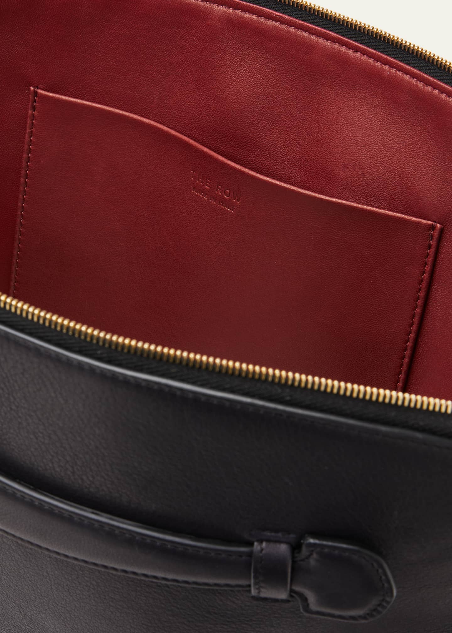 The Row Ellie Clutch Bag in Saddle Leather