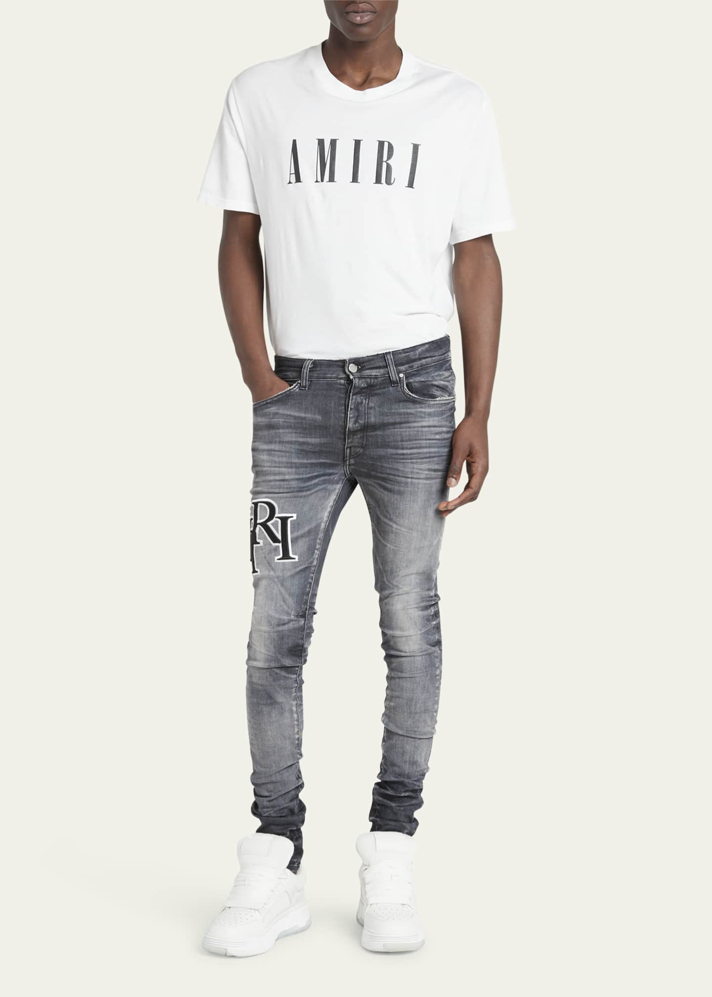 Amiri Men's Faded Skinny Jeans with Staggered Logo - Bergdorf Goodman