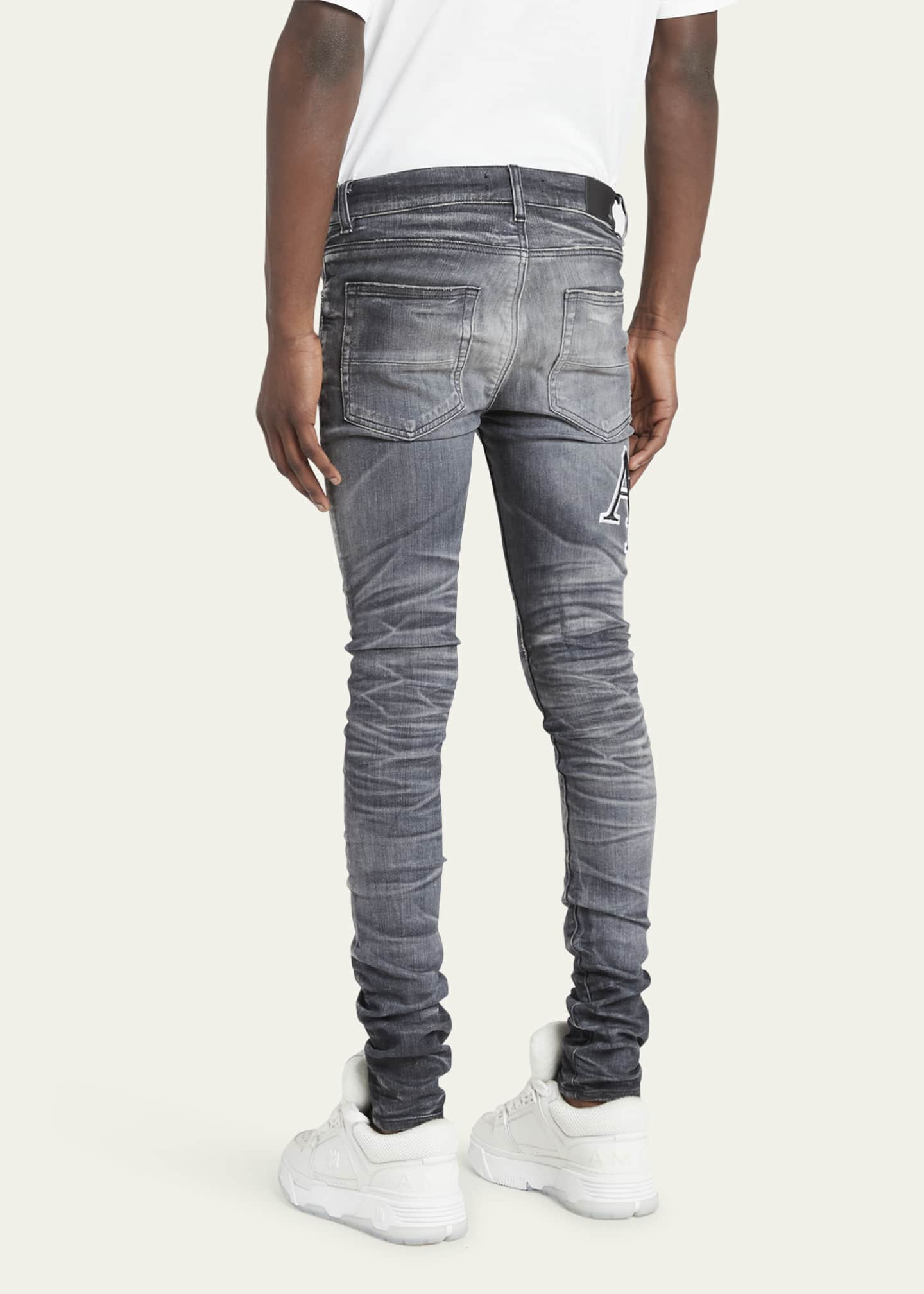 Amiri Men's Faded Skinny Jeans with Staggered Logo - Bergdorf Goodman