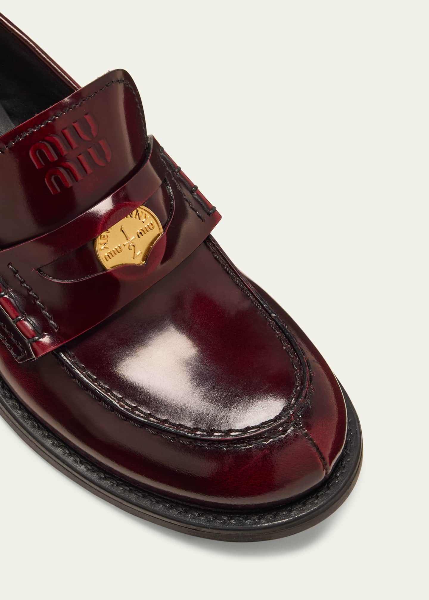 Miu Miu Leather Heeled Penny Loafers