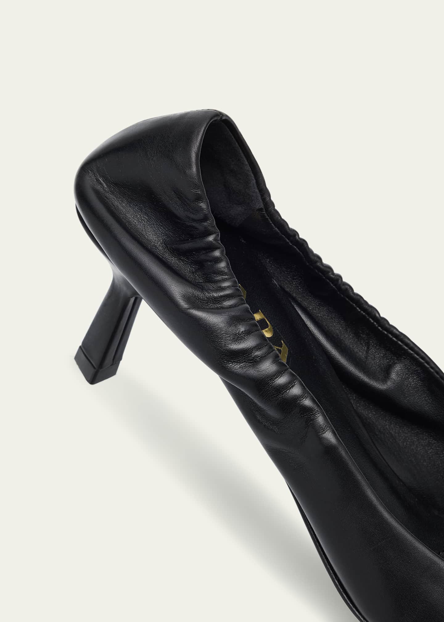 Triangle Logo Leather Pumps