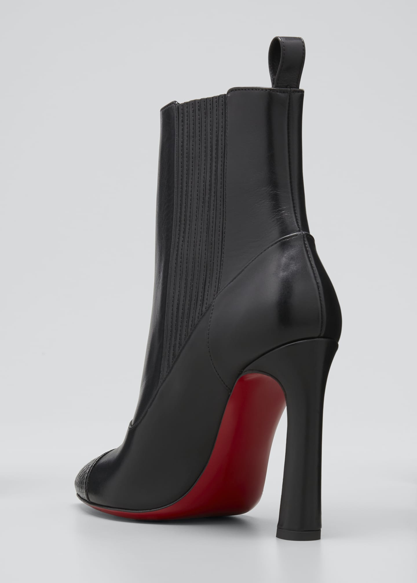 black boots with red bottoms